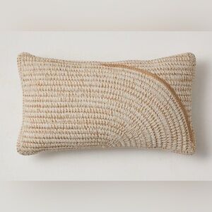West Elm tan and cream lumbar indoor and outdoor pillow.